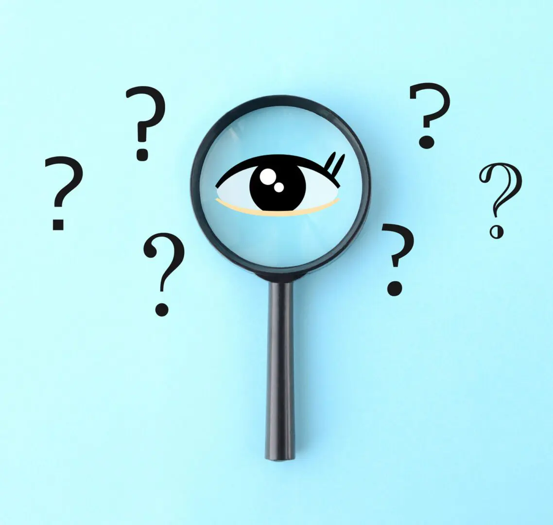 Magnifying glass with eye and question marks.